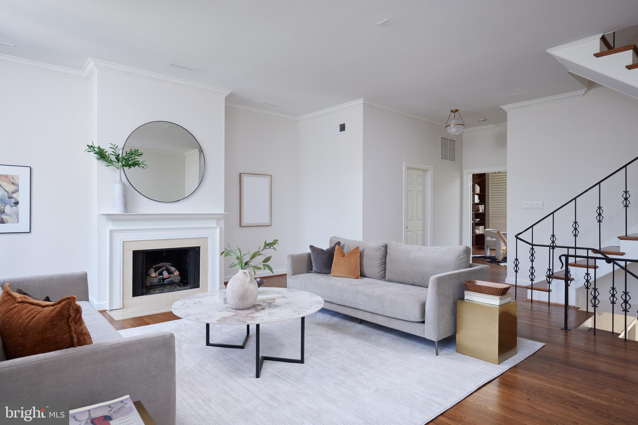 1802 Kalorama Square, Unit 16 Washington, DC 20008 - Photo 26 of 58 a living room with furniture a fireplace and a potted plant