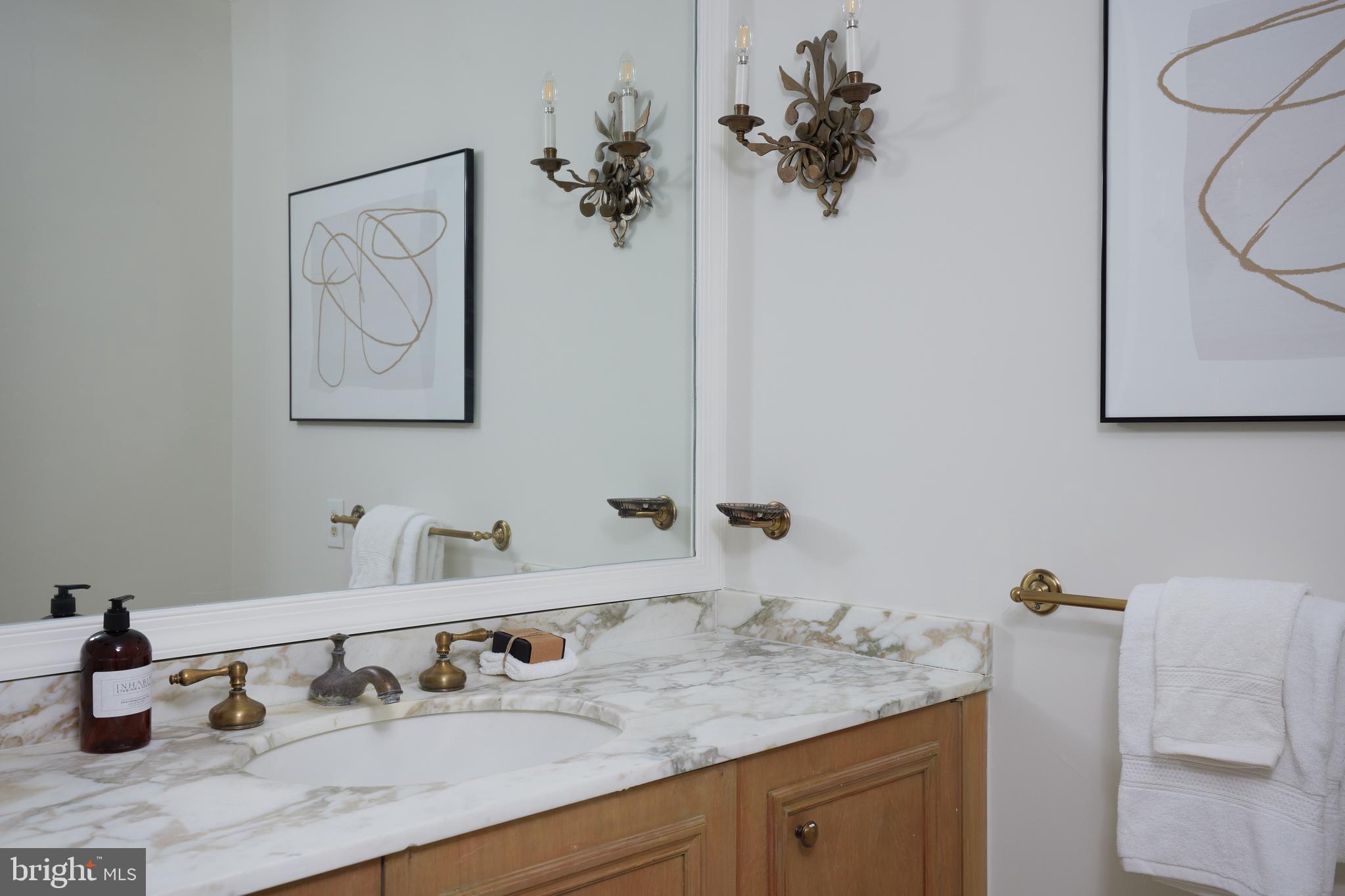 1802 Kalorama Square, Unit 16 Washington, DC 20008 - Photo 27 of 58 a bathroom with a sink and a mirror