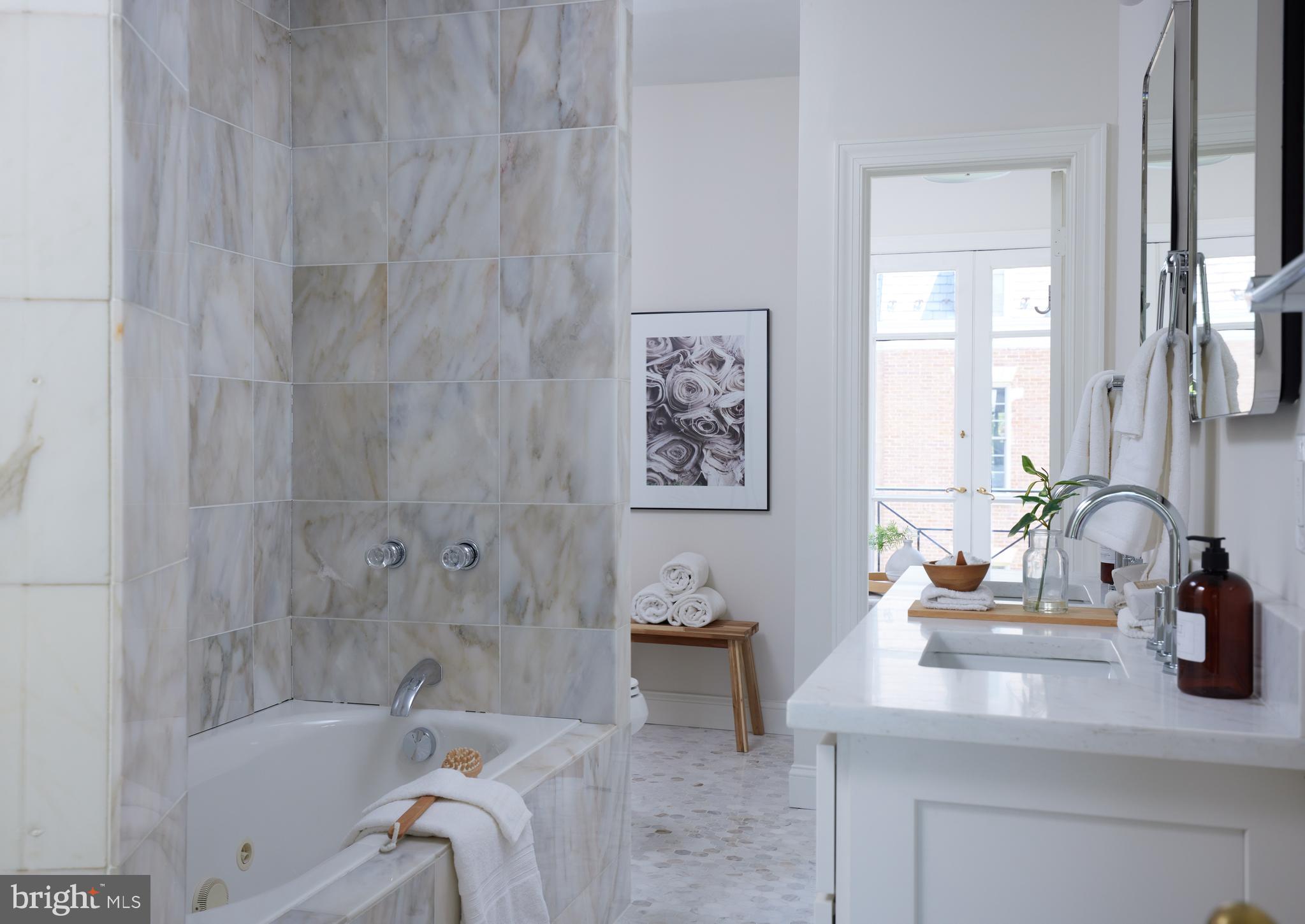 1802 Kalorama Square, Unit 16 Washington, DC 20008 - Photo 35 of 58 a bath tub sitting next to a bathroom sink