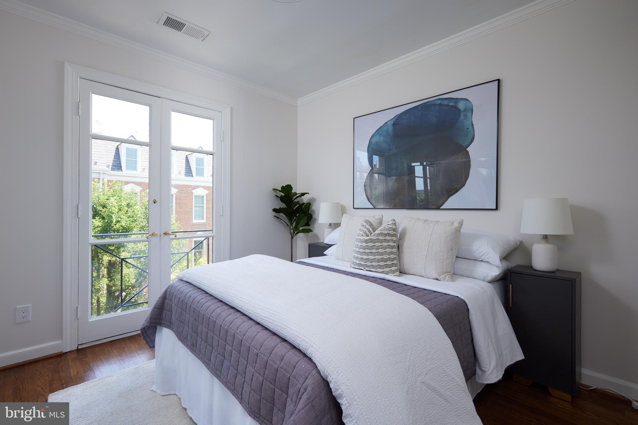 1802 Kalorama Square, Unit 16 Washington, DC 20008 - Photo 39 of 58 a bedroom with a bed and a mirror