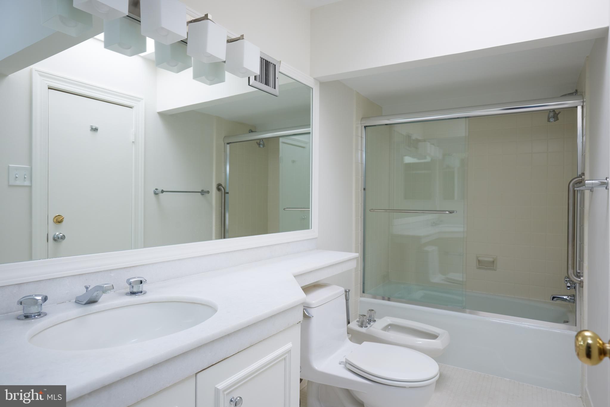 1802 Kalorama Square, Unit 16 Washington, DC 20008 - Photo 46 of 58 a bathroom with a sink a toilet and shower