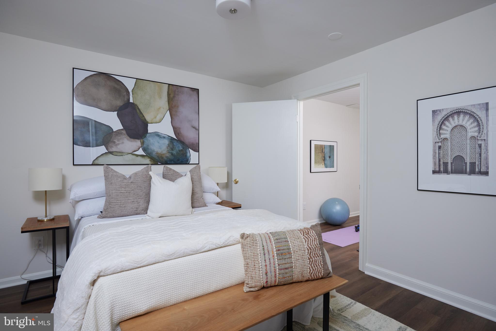 1802 Kalorama Square, Unit 16 Washington, DC 20008 - Photo 49 of 58 a bedroom with a bed and wooden floor