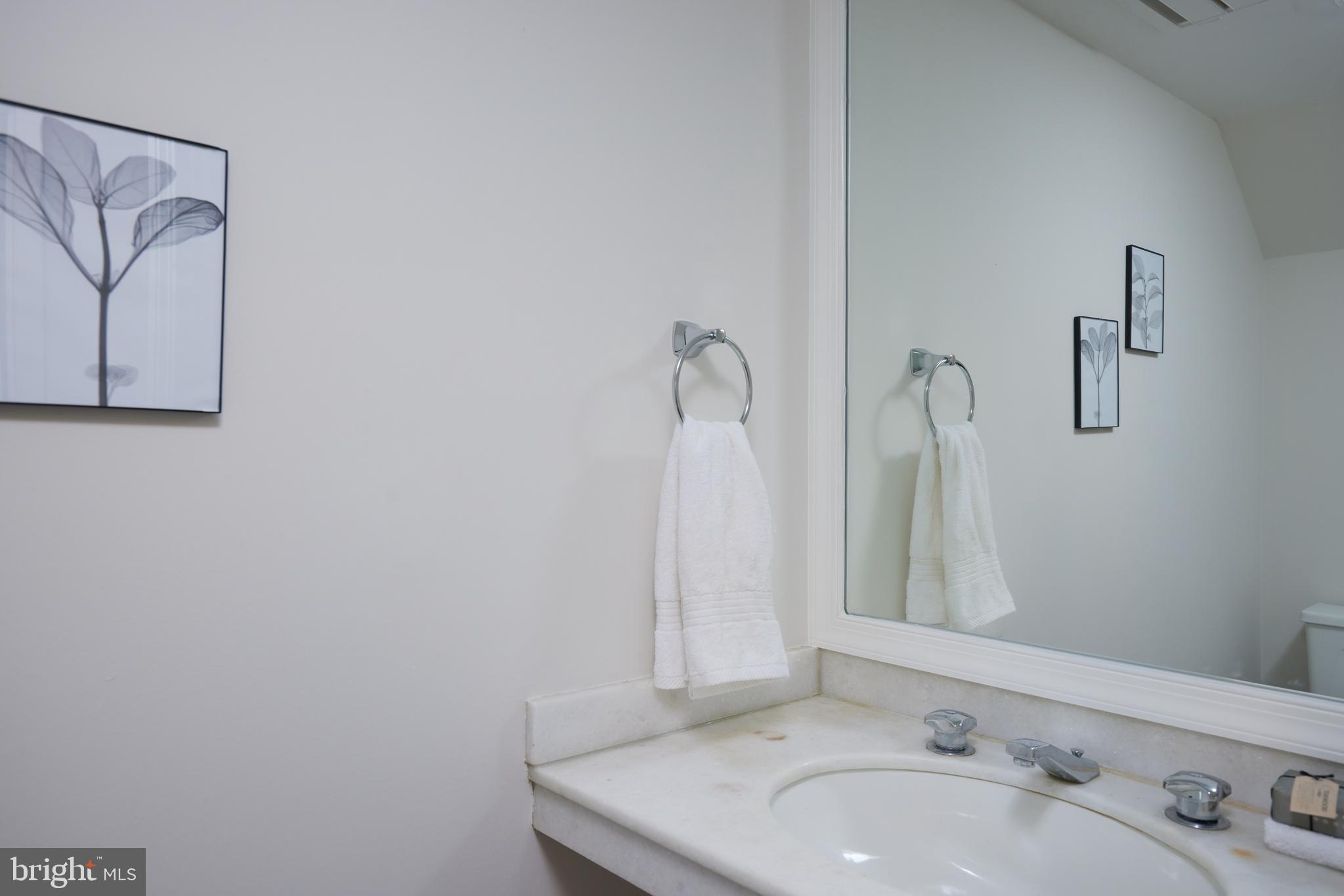 1802 Kalorama Square, Unit 16 Washington, DC 20008 - Photo 51 of 58 a bathroom with a sink and a mirror