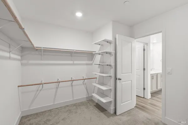 a view of a bathroom from a hallway