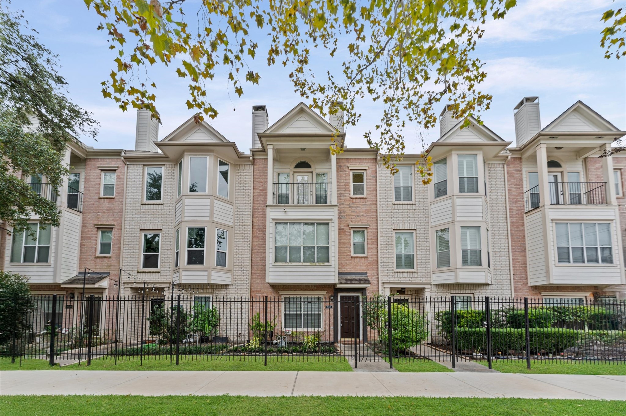 2905 Crawford Street Houston, TX 77004 - Photo 1 of 28 a front view of a residential apartment building with a yard