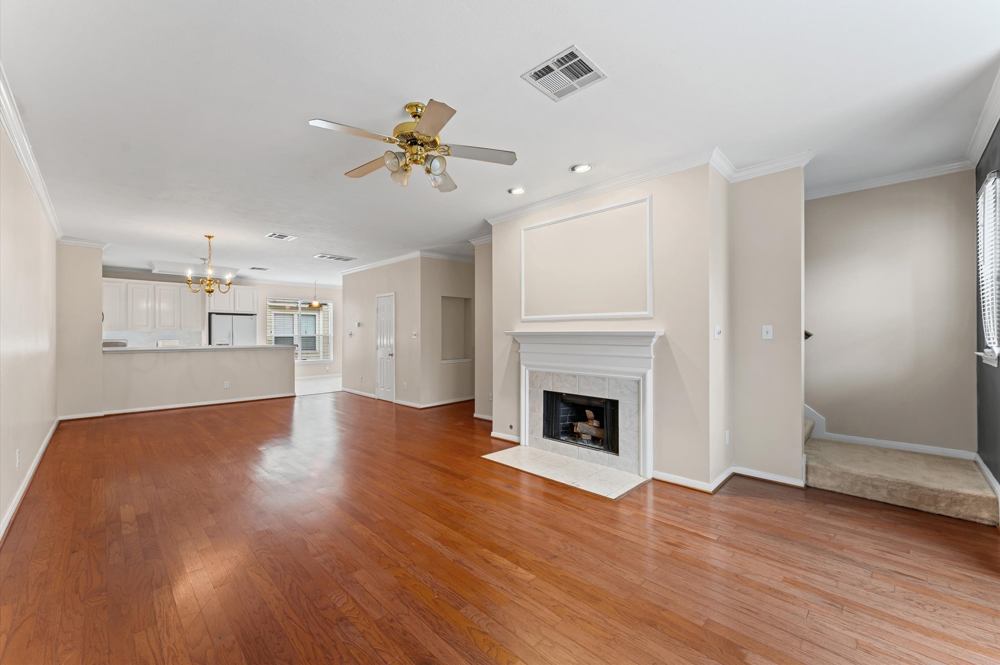 2905 Crawford Street Houston, TX 77004 - Photo 12 of 28 a view of an empty room with wooden floor and a fireplace