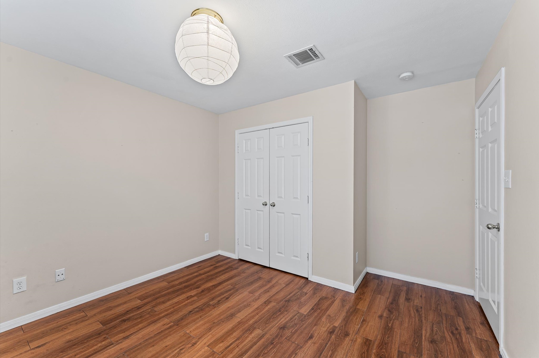 2905 Crawford Street Houston, TX 77004 - Photo 14 of 28 a view of a room with wooden floor and white walls