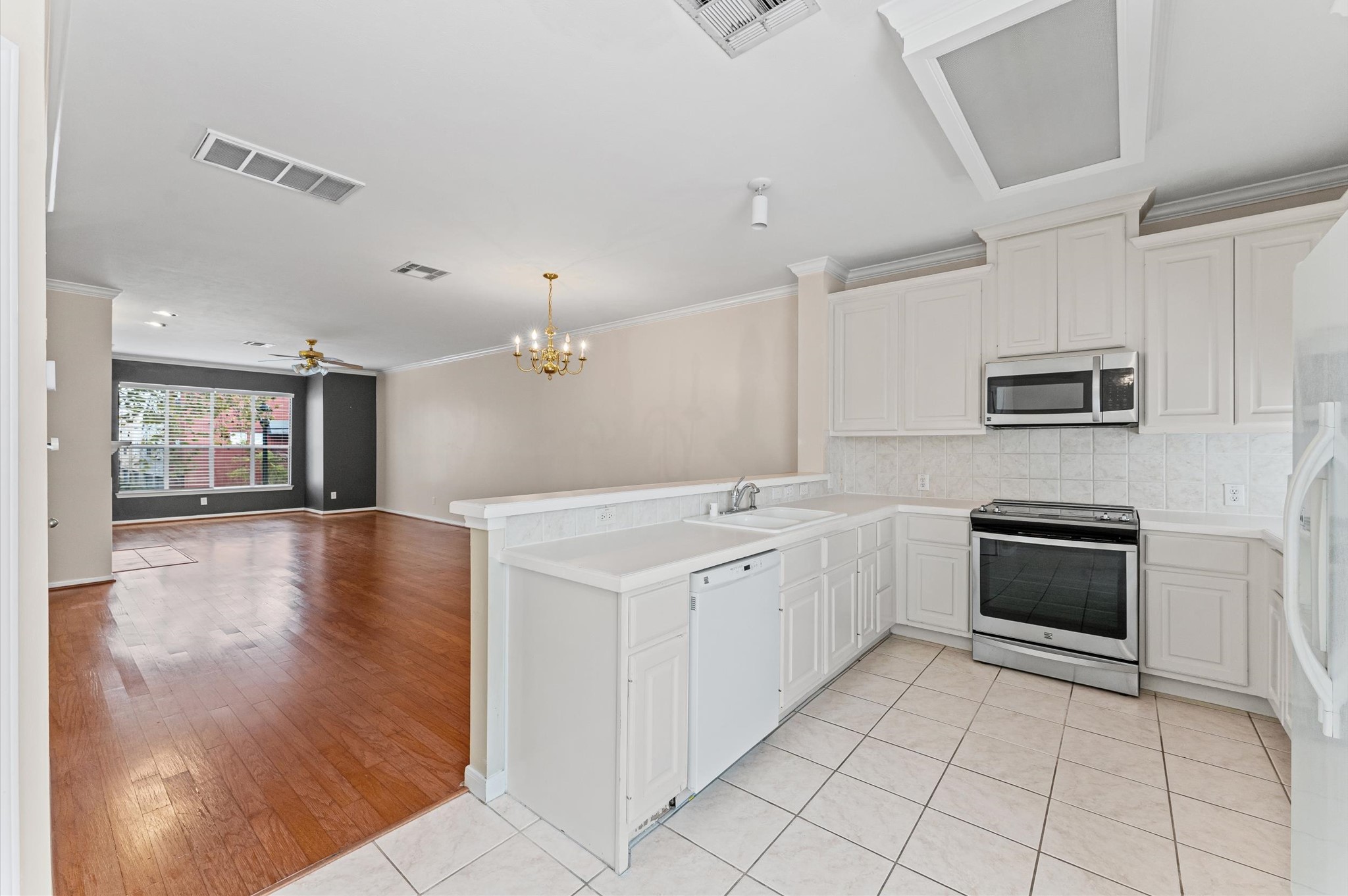 2905 Crawford Street Houston, TX 77004 - Photo 6 of 28 a kitchen with granite countertop a stove top oven and cabinets