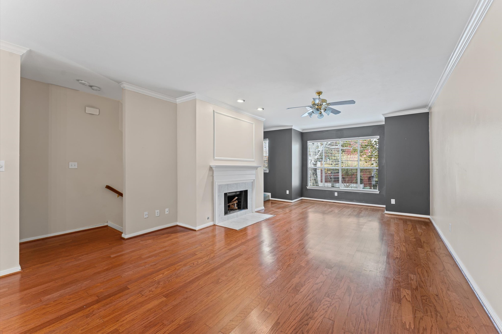 2905 Crawford Street Houston, TX 77004 - Photo 10 of 28 a view of an empty room with wooden floor and a window