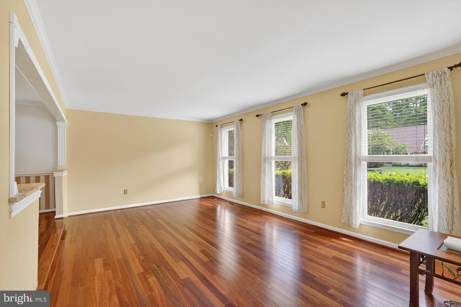 2108 Merrifields Drive Silver Spring, MD 20906 - Photo 5 of 69 a view of an empty room with wooden floor and a window