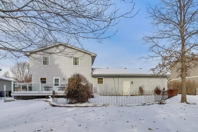 a view of a house with a snow in the yard