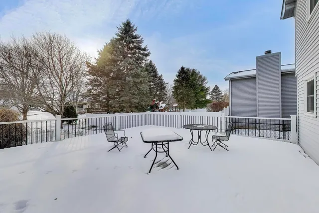 a view of a patio with a table and chairs