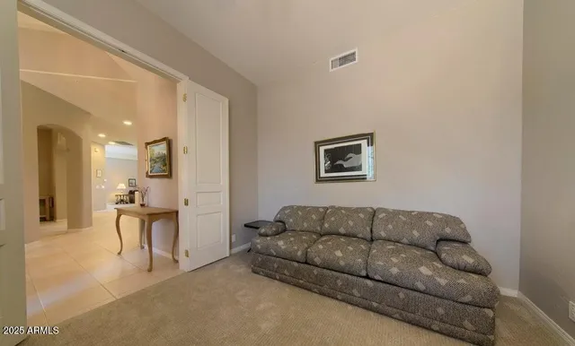 a living room with furniture and a couch