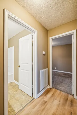 an empty room with closet and a mirror