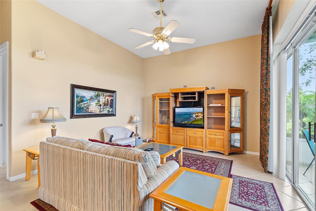 2817 Falcon Ridge Clermont, FL 34711 - Photo 13 of 41 a living room with furniture and a window