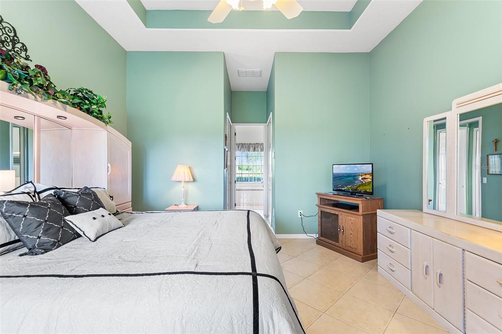 2817 Falcon Ridge Clermont, FL 34711 - Photo 22 of 41 a bedroom with granite countertop cabinets and flat screen tv