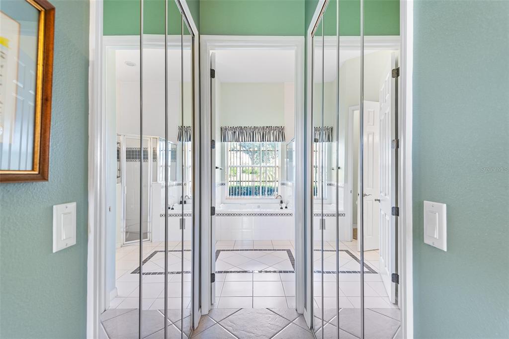 2817 Falcon Ridge Clermont, FL 34711 - Photo 24 of 41 a bathroom with a glass shower door