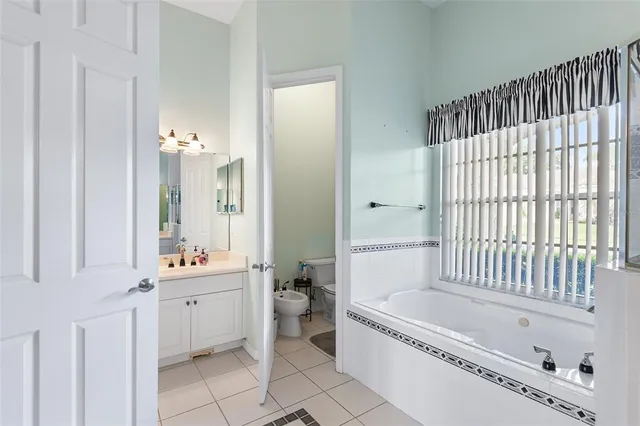 a bathroom with a bathtub and a sink