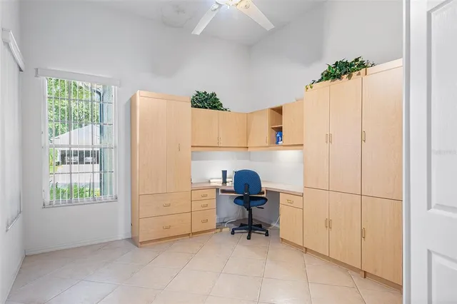 a room with a chair and a flat screen tv