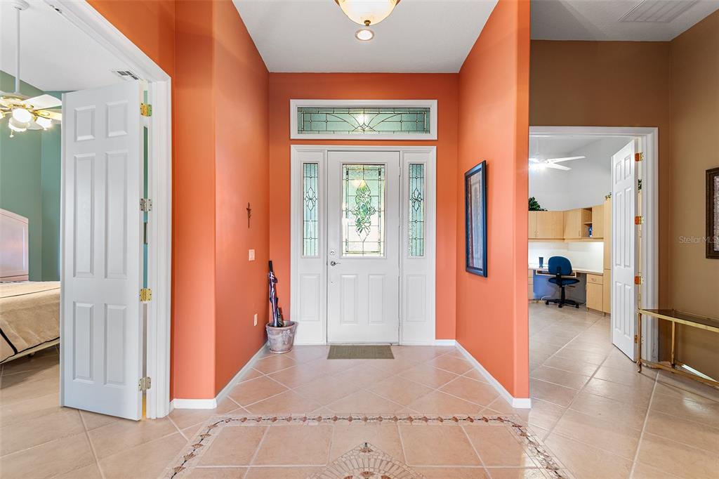 2817 Falcon Ridge Clermont, FL 34711 - Photo 5 of 41 a view of a hallway with a livingroom and a livingroom with furniture