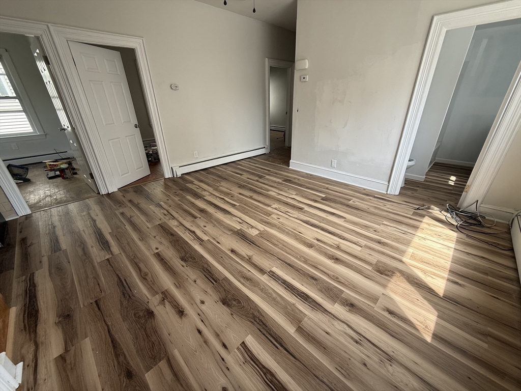 631 Walnut Street, Unit 1 Fall River, MA 02720 - Photo 5 of 12 a view of a room with wooden floor