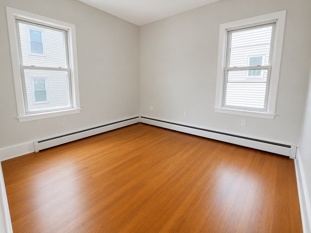 631 Walnut Street, Unit 1 Fall River, MA 02720 - Photo 9 of 12 an empty room with a window