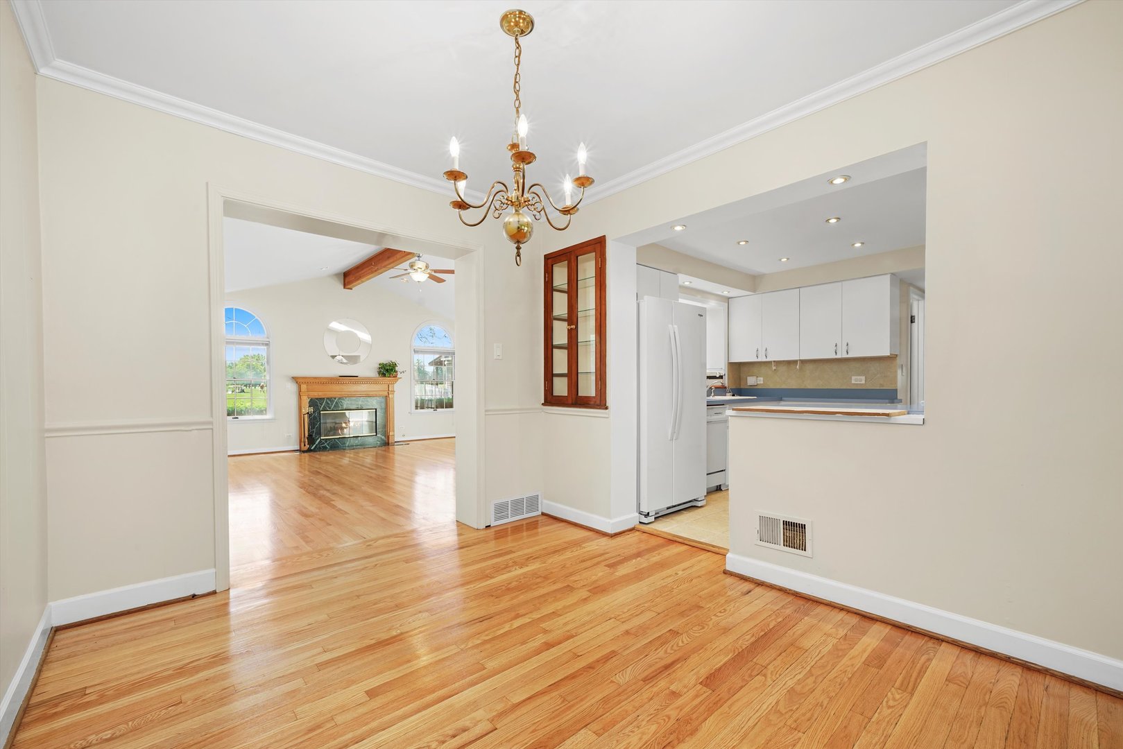2525 Glenview Road Glenview, IL 60025 - Photo 11 of 50 a view of a kitchen with wooden floor and a ceiling fan