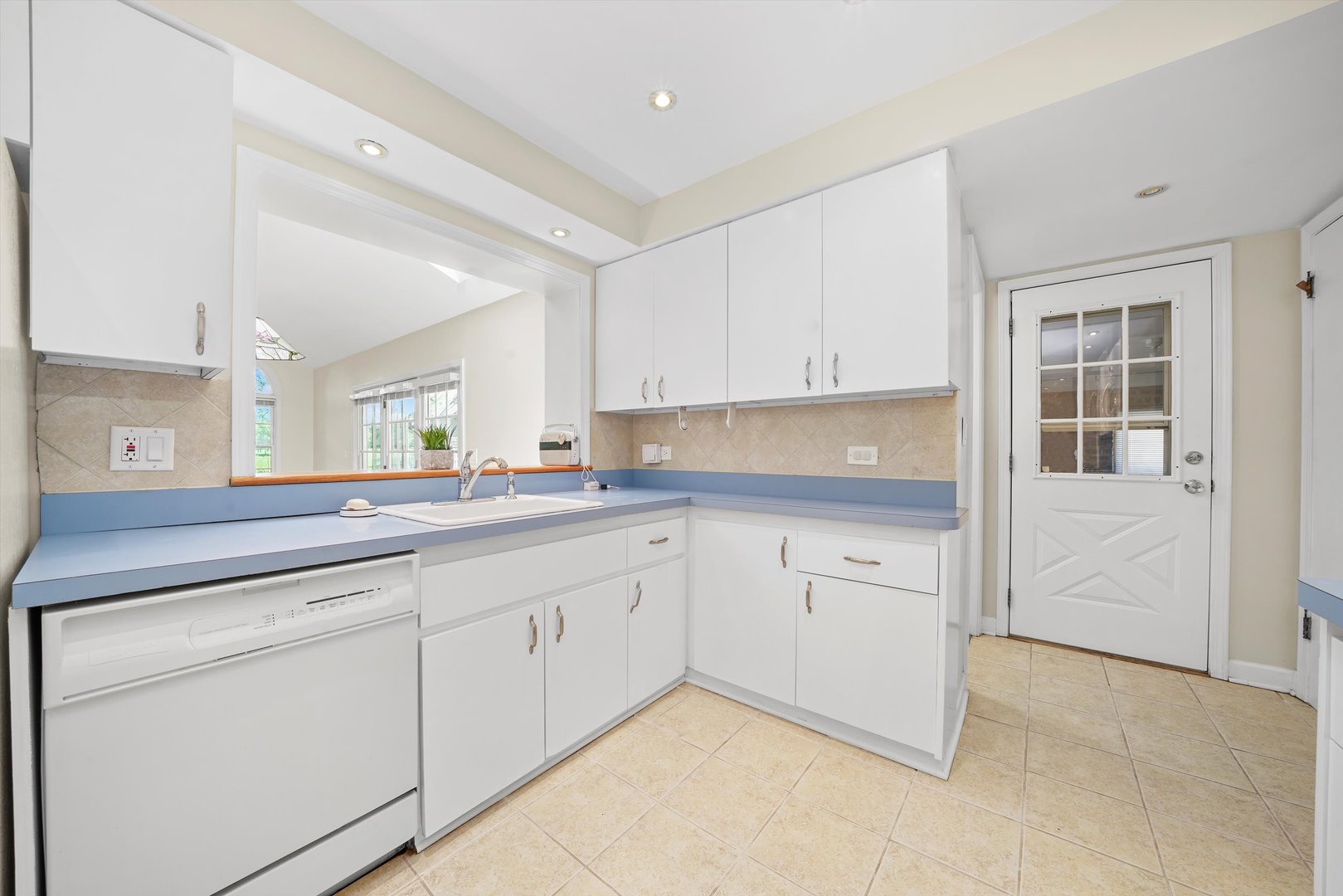 2525 Glenview Road Glenview, IL 60025 - Photo 14 of 50 a kitchen with granite countertop white cabinets and white appliances