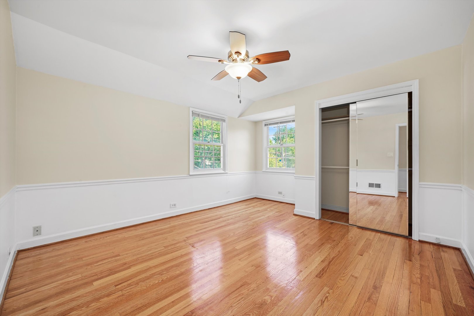 2525 Glenview Road Glenview, IL 60025 - Photo 31 of 50 an empty room with wooden floor fan and windows