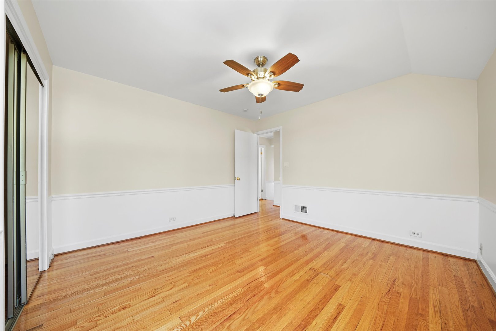 2525 Glenview Road Glenview, IL 60025 - Photo 32 of 50 an empty room with a window and a ceiling fan