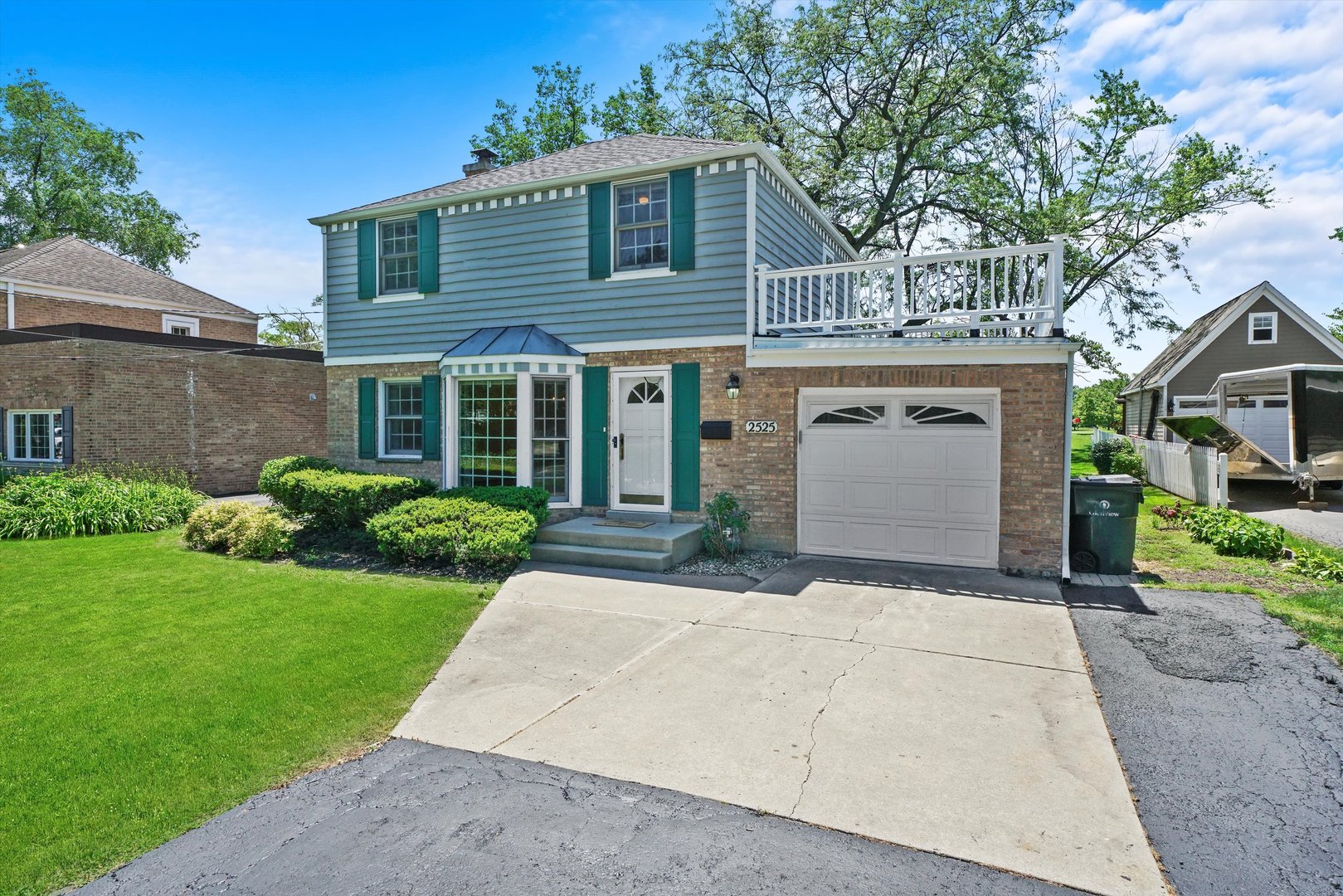 2525 Glenview Road Glenview, IL 60025 - Photo 44 of 50 a front view of a house with a garden and garage