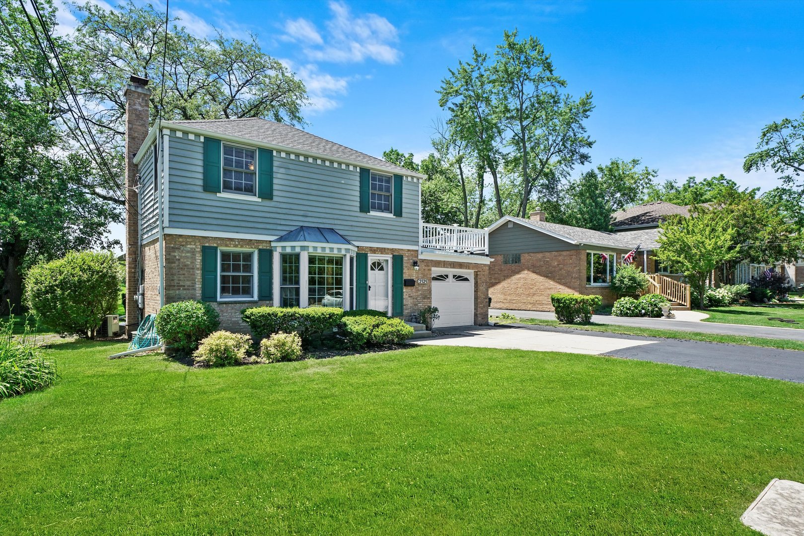 2525 Glenview Road Glenview, IL 60025 - Photo 46 of 50 a front view of a house with a yard and trees