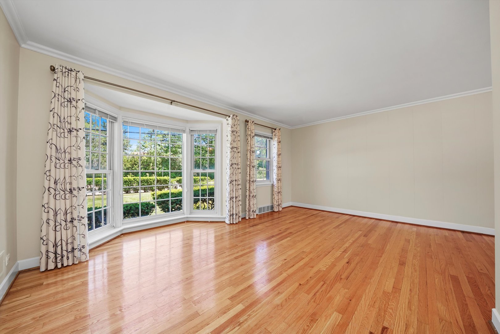 2525 Glenview Road Glenview, IL 60025 - Photo 8 of 50 a view of an empty room with wooden floor and a window