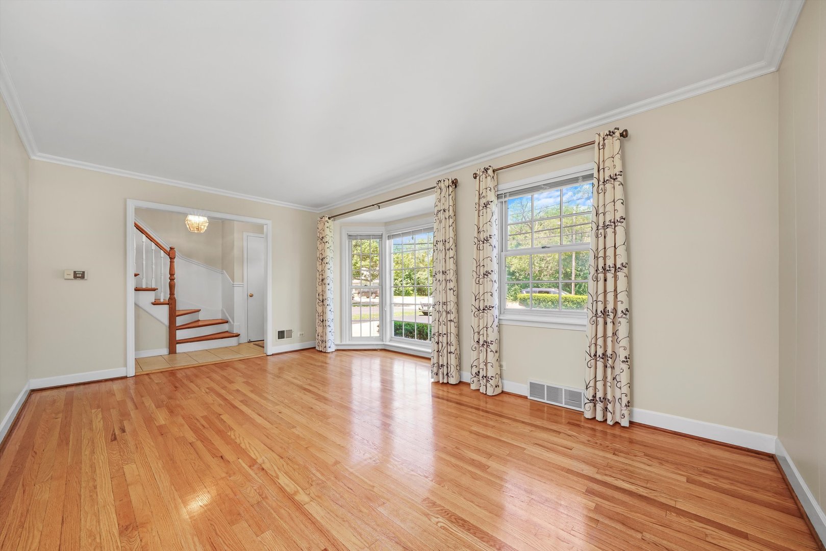 2525 Glenview Road Glenview, IL 60025 - Photo 9 of 50 a view of an empty room with wooden floor and a window