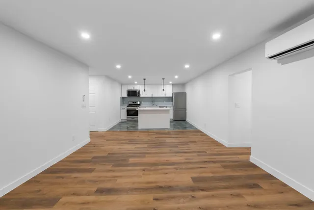a view of kitchen with wooden floor