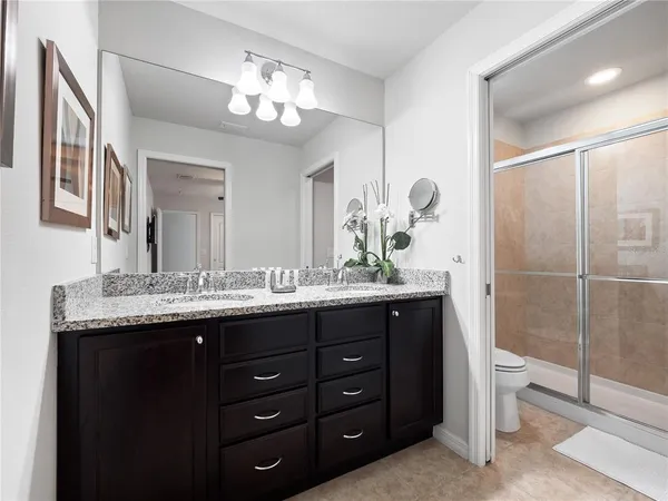 a spacious bedroom with a bed and a large window