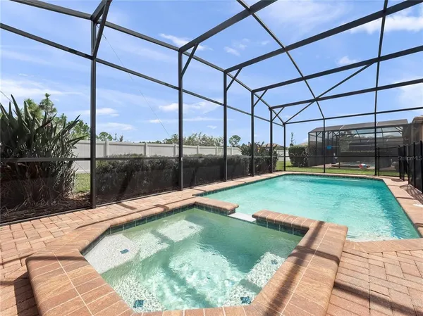 a view of a swimming pool with a porch