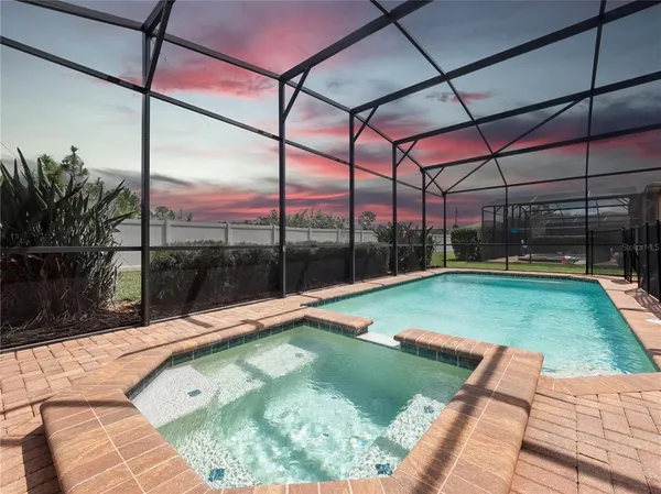 a view of swimming pool with outdoor seating