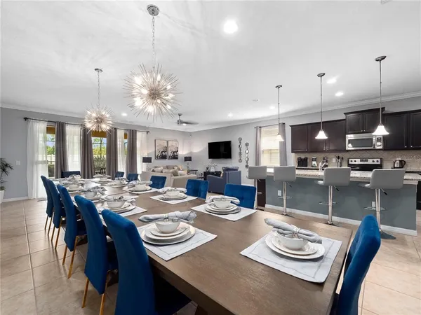 a kitchen with granite countertop stainless steel appliances a sink a counter top space a sink and cabinets