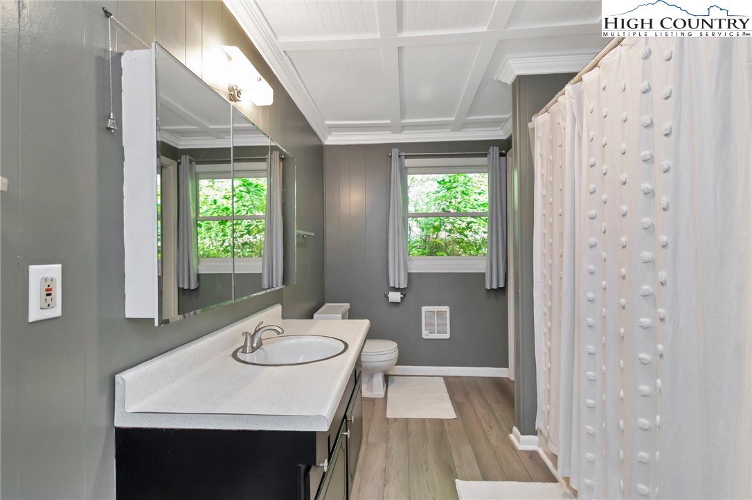 2209-2211 Sugar Mountain 2 Road Newland, NC 28657 - Photo 46 of 50 a view of a dining room with furniture window and wooden floor