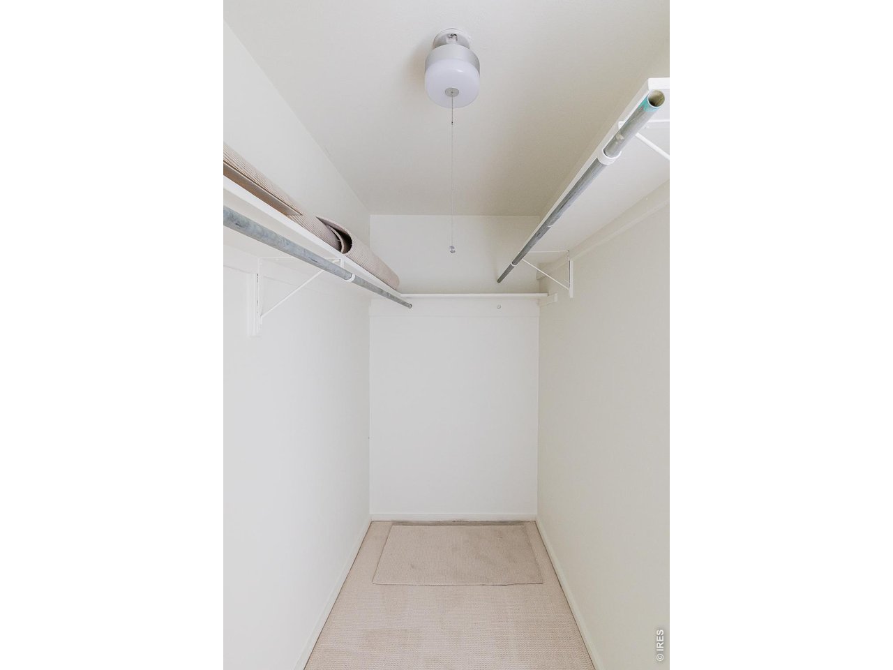 8050 Niwot Road, Unit 28 Niwot, CO 80503 - Photo 21 of 33 a view of a hallway with a white walls
