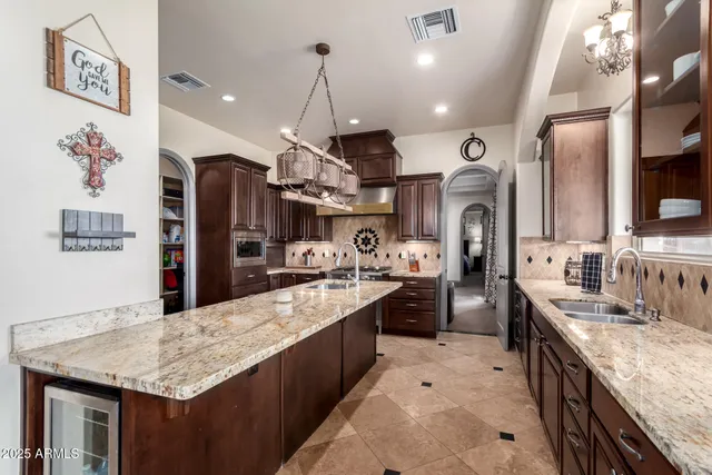 a bedroom with a bed dresser and a large window