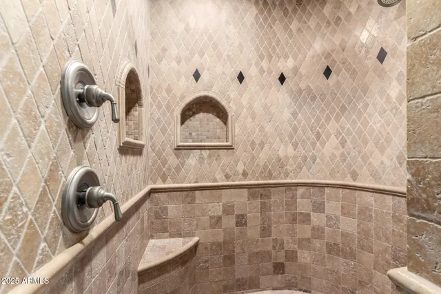 a living room with furniture a flat screen tv and a floor to ceiling window