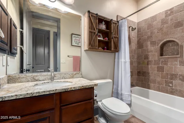 a view of a big house with a big yard and large tree