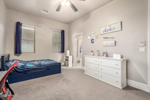 a view of a terrace with a table and chairs