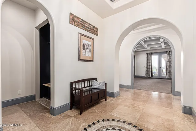 a kitchen with granite countertop a sink and a stove