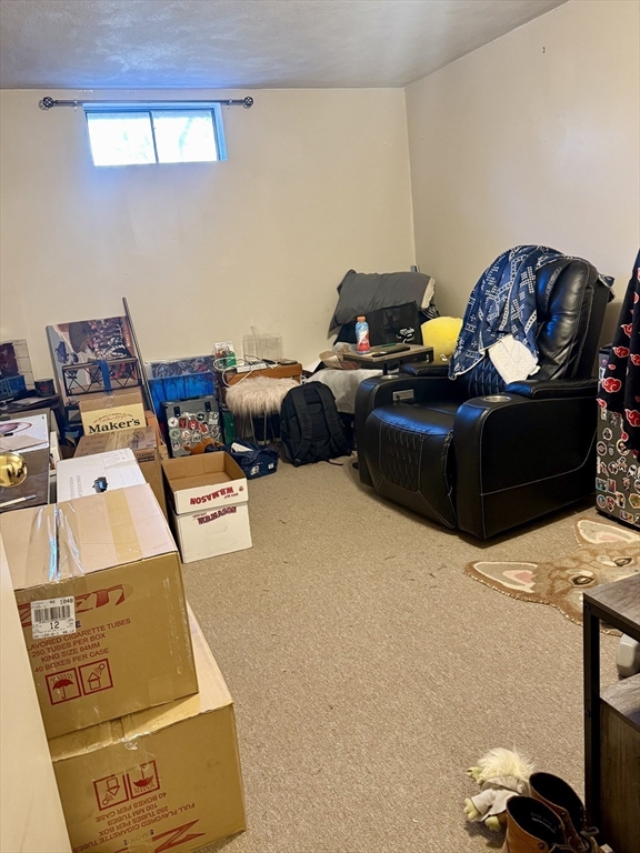 567 Mendon Road, Unit 1 Attleboro, MA 02703 - Photo 11 of 12 a living room with furniture and a window