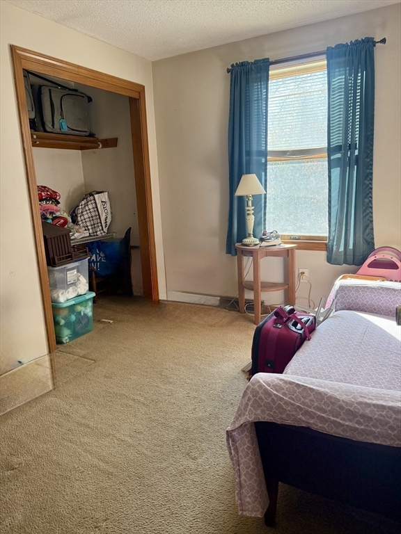 567 Mendon Road, Unit 1 Attleboro, MA 02703 - Photo 10 of 12 a bedroom with a bed and a window