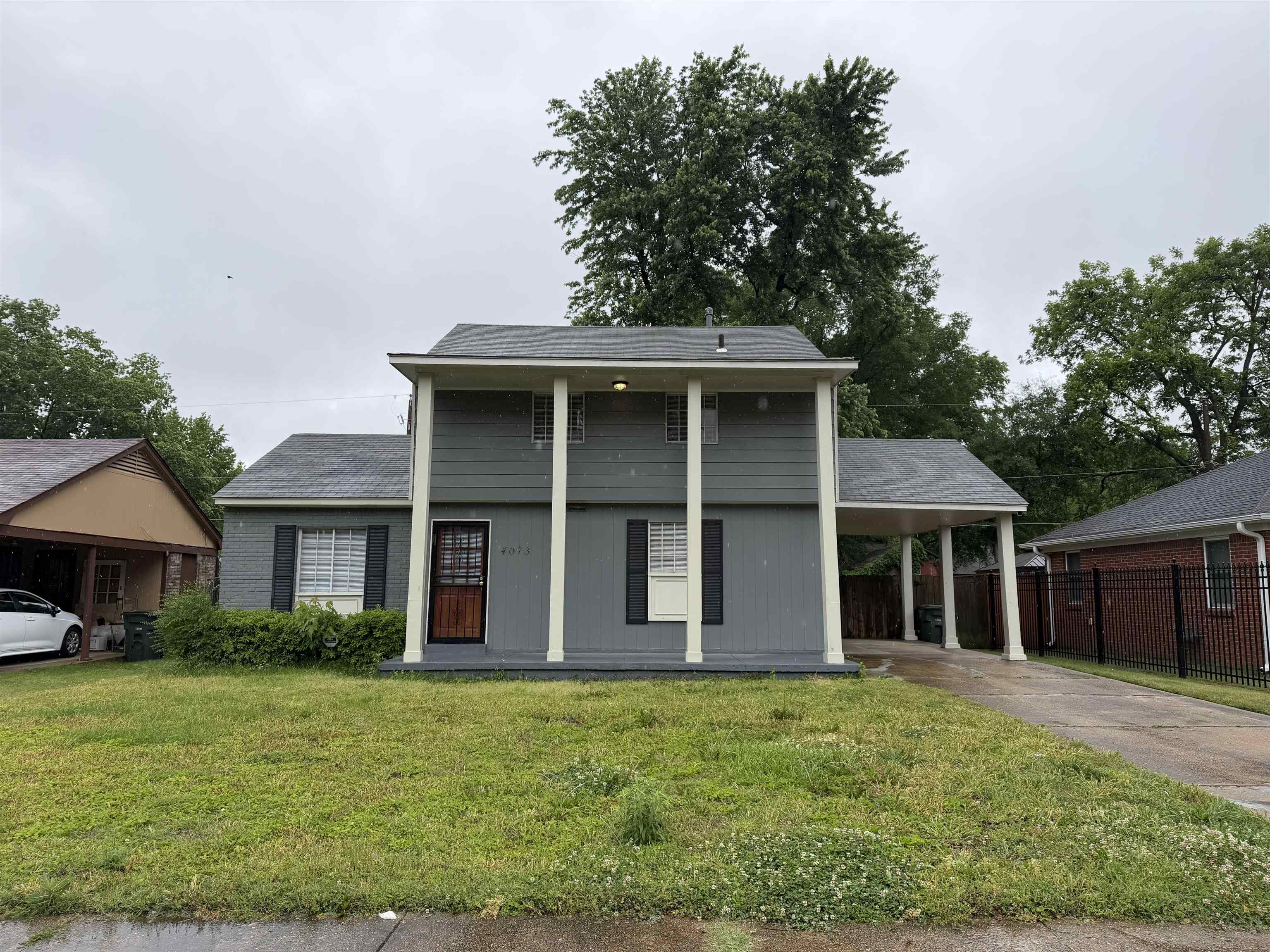 4073 Arrowhead Road Memphis, TN 38118 - Photo 1 of 10 a front view of a house with a garden