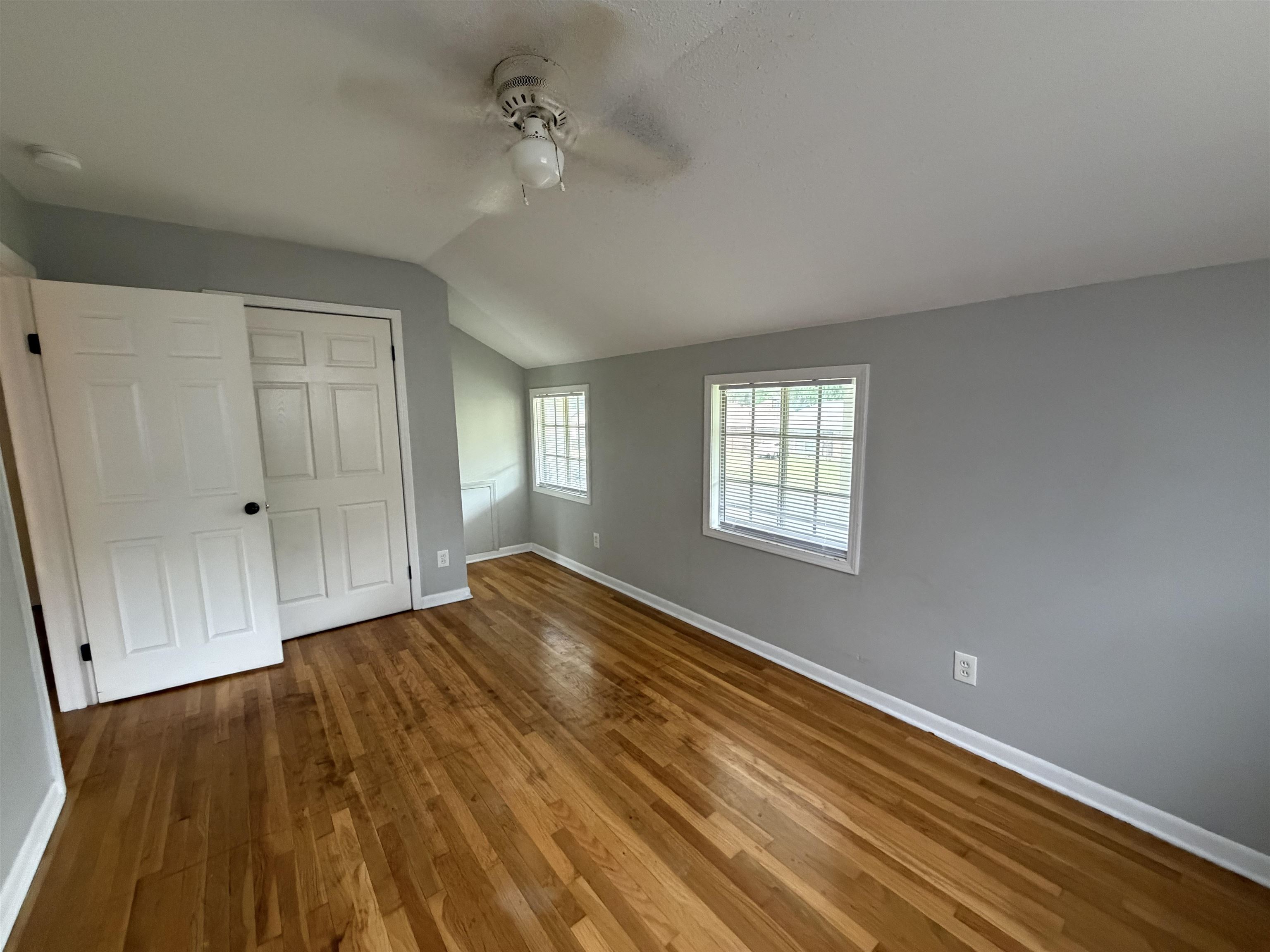4073 Arrowhead Road Memphis, TN 38118 - Photo 8 of 10 a view of empty room with wooden floor and fan